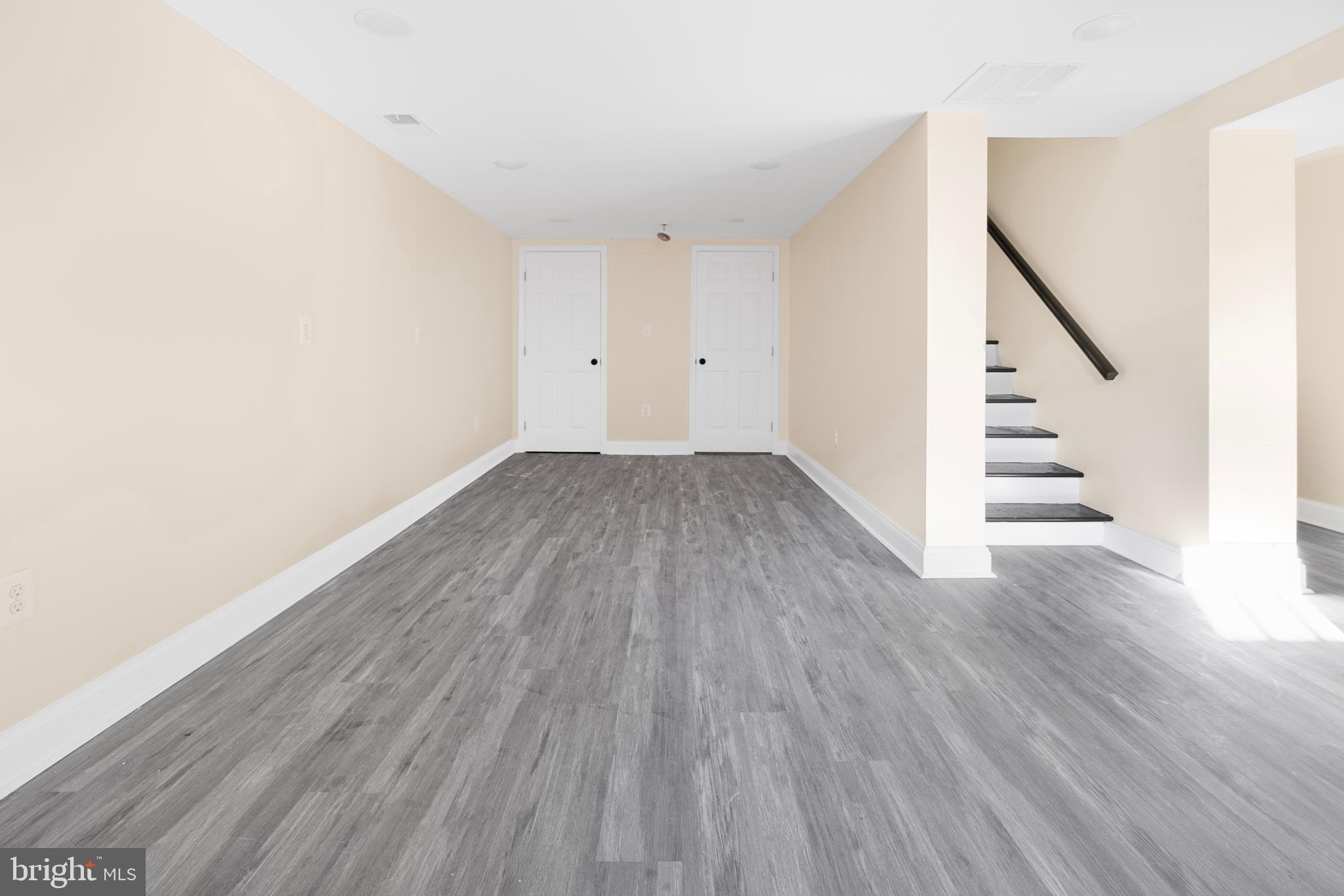713 Marcy Avenue Oxon Hill, MD 20745 - Photo 20 of 24 a view of a hallway with wooden floor
