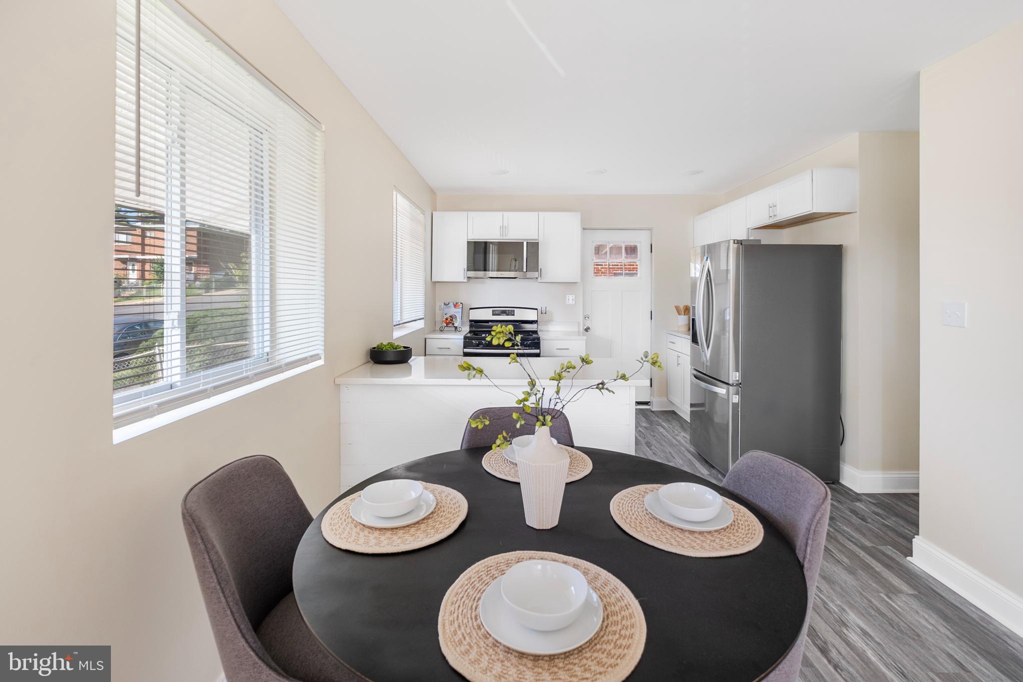 713 Marcy Avenue Oxon Hill, MD 20745 - Photo 4 of 24 a dining room with furniture and wooden floor