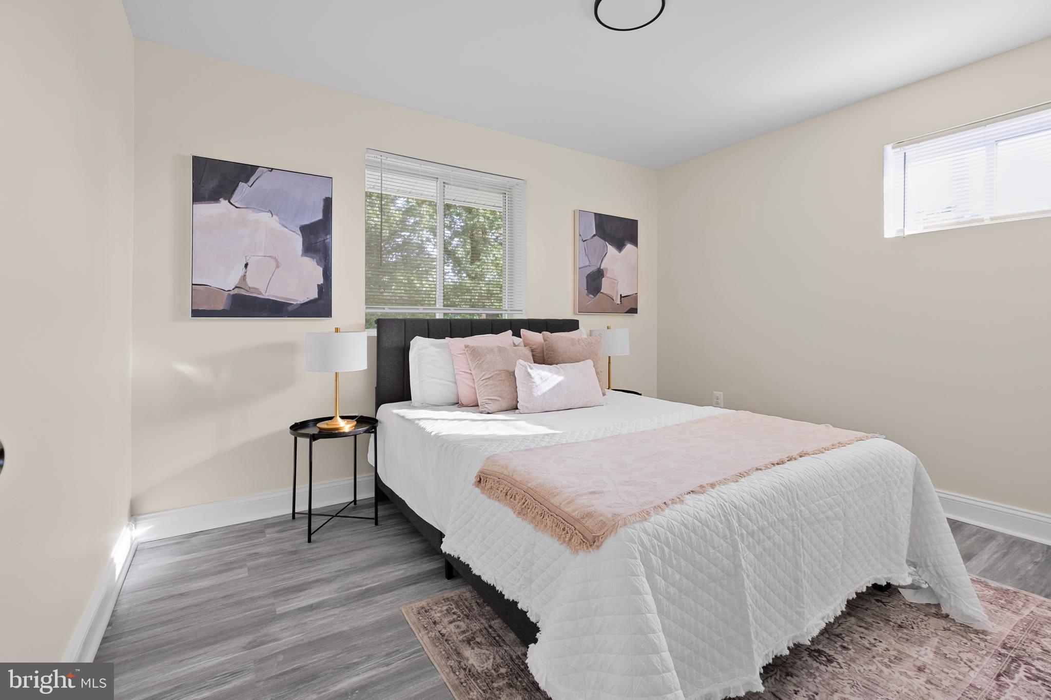 713 Marcy Avenue Oxon Hill, MD 20745 - Photo 9 of 24 a bedroom with a bed and a painting on the wall