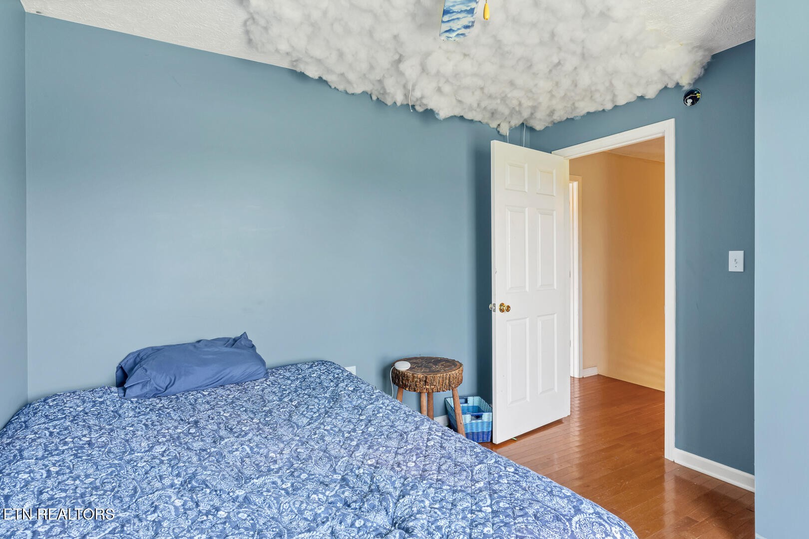 1565 Ellejoy Road Seymour, TN 37865 - Photo 17 of 27 a bedroom with a bed and wooden floor