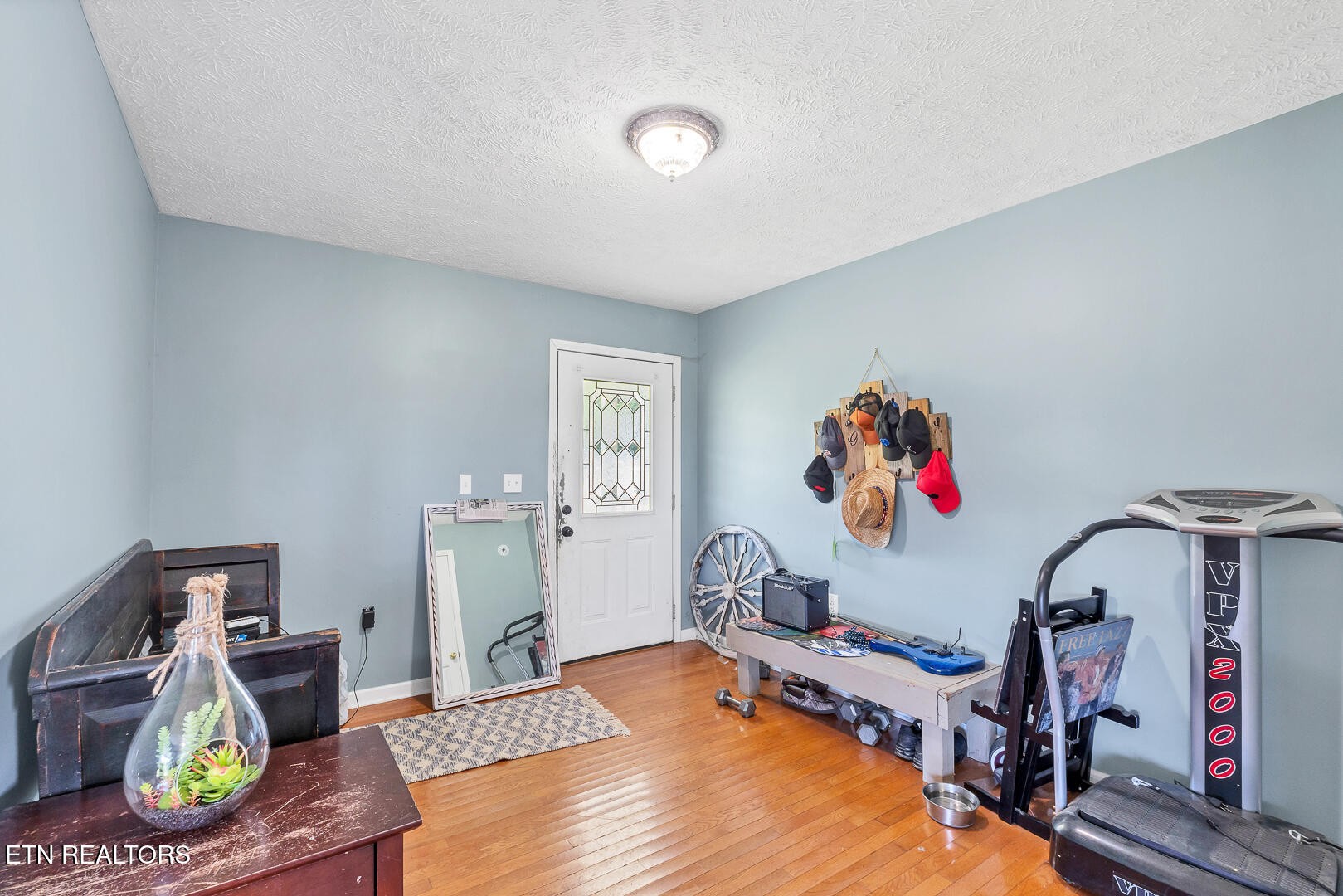 1565 Ellejoy Road Seymour, TN 37865 - Photo 4 of 27 a bedroom with a bed and wooden floor