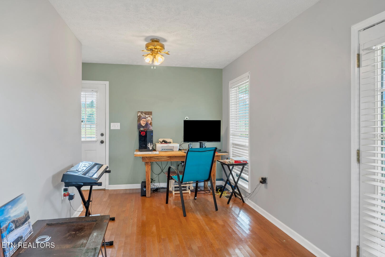 1565 Ellejoy Road Seymour, TN 37865 - Photo 10 of 27 a workspace with furniture and wooden floor