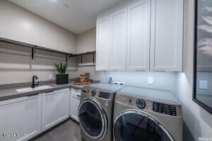 82 Caballada Street Reno, NV 89511 - Photo 22 of 39 a utility room with sink dryer and washer