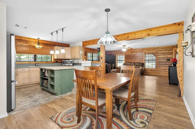 a dining room with furniture and window