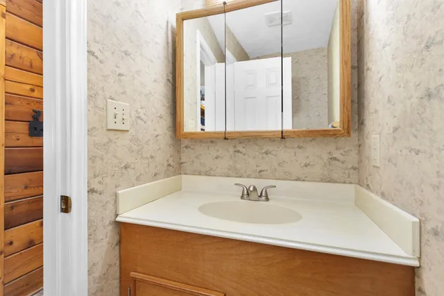 a bathroom with a sink and a shower