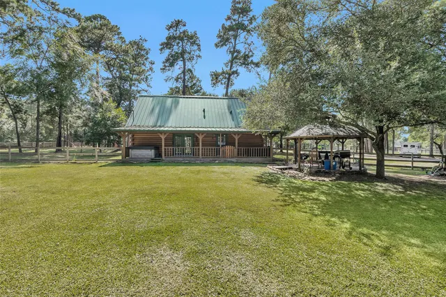 a view of house with outdoor space and swimming pool
