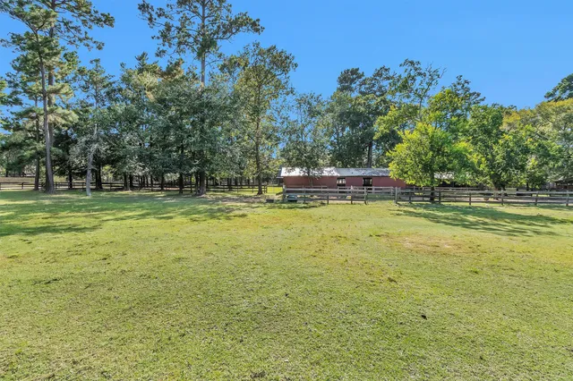 a view of a swimming pool with a yard