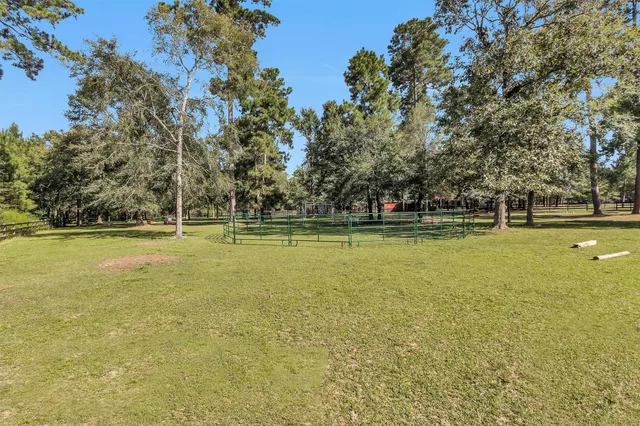 a view of a swimming pool with an outdoor space and seating area