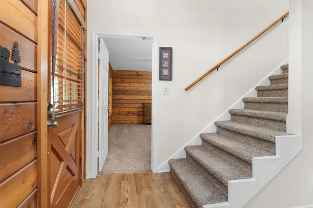 a view of staircase with wooden floor and staircase