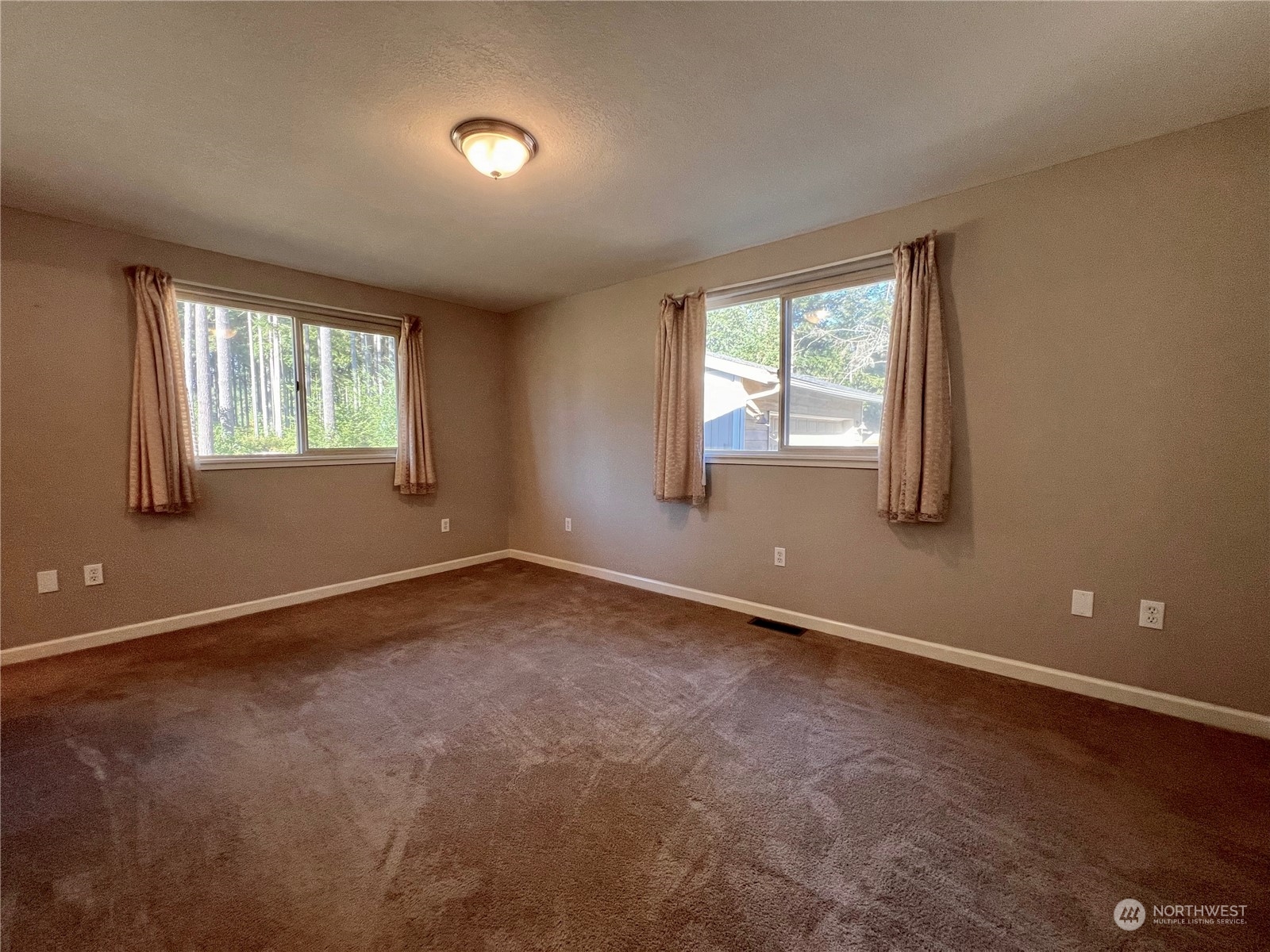 1951 Southeast Van Skiver Road Port Orchard, WA 98367 - Photo 12 of 30 an empty room with windows
