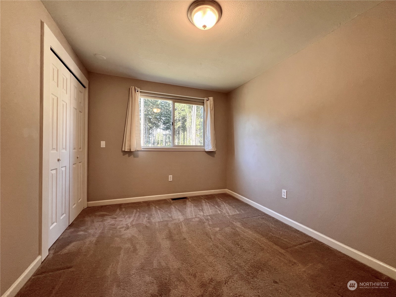 1951 Southeast Van Skiver Road Port Orchard, WA 98367 - Photo 15 of 30 an empty room with windows and closet