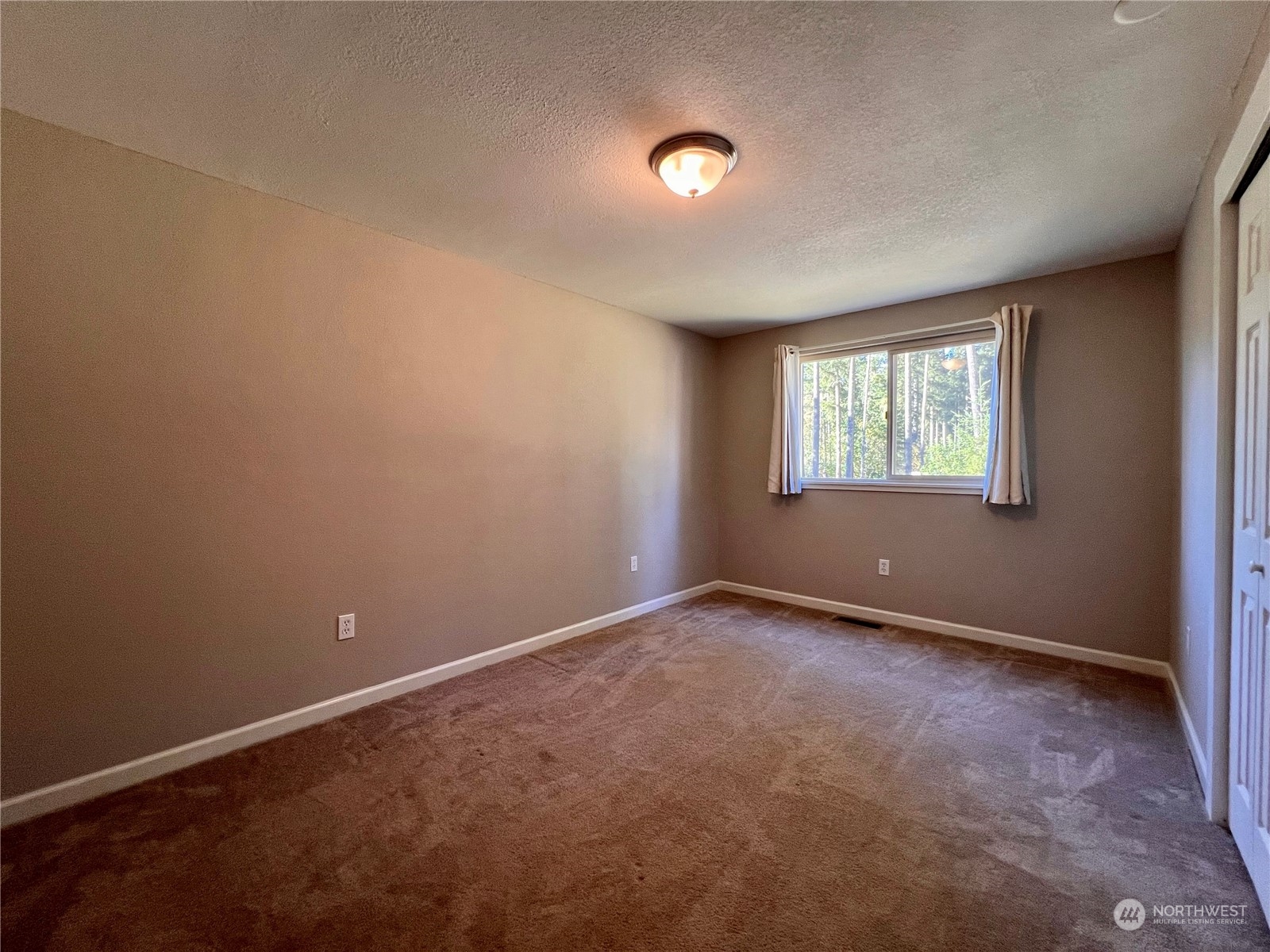 1951 Southeast Van Skiver Road Port Orchard, WA 98367 - Photo 16 of 30 an empty room with windows