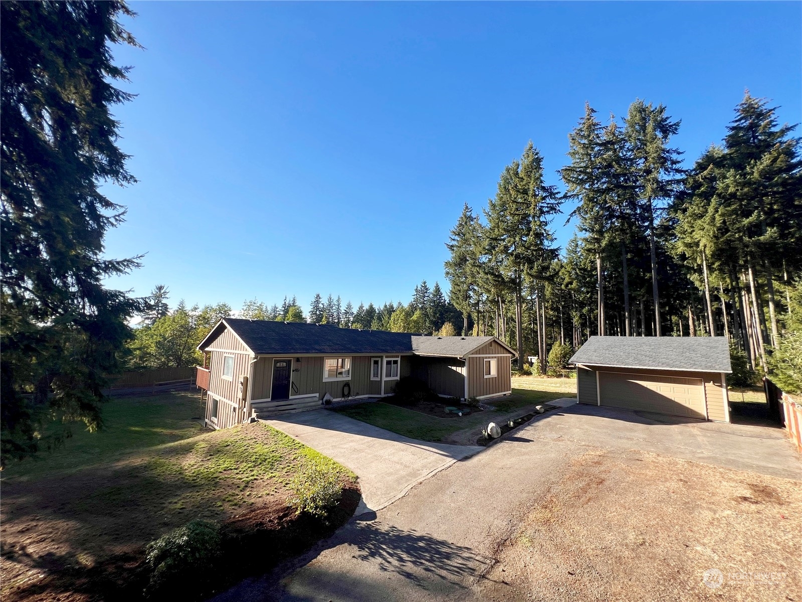 1951 Southeast Van Skiver Road Port Orchard, WA 98367 - Photo 2 of 30 a front view of a house with a yard