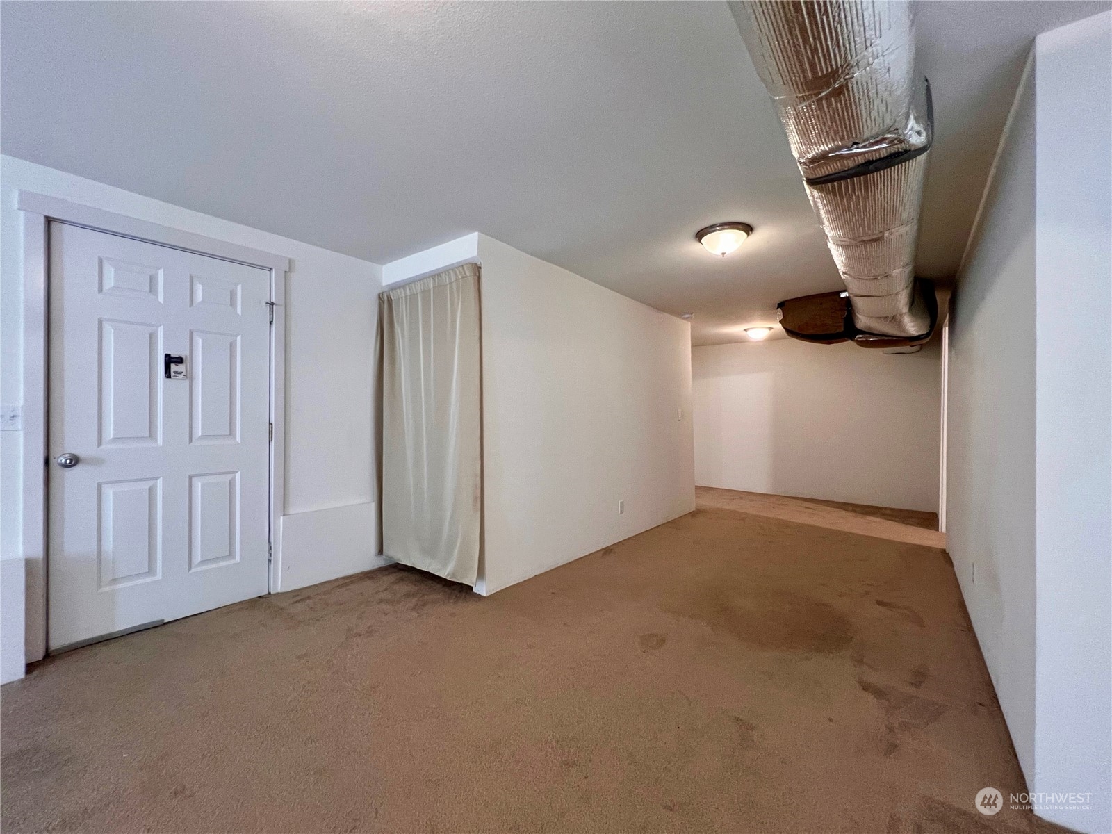 1951 Southeast Van Skiver Road Port Orchard, WA 98367 - Photo 21 of 30 a view of a livingroom with a staircase