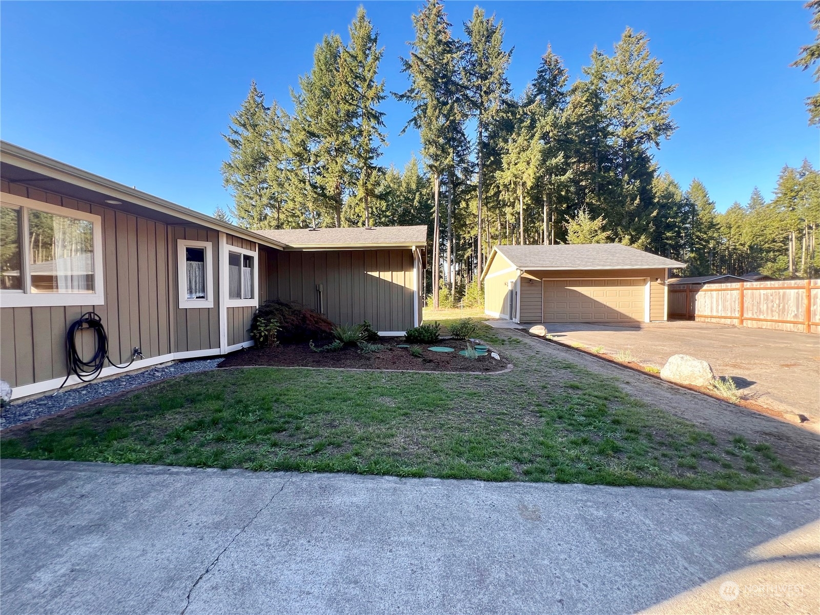1951 Southeast Van Skiver Road Port Orchard, WA 98367 - Photo 23 of 30 a view of a backyard with a garden and plants