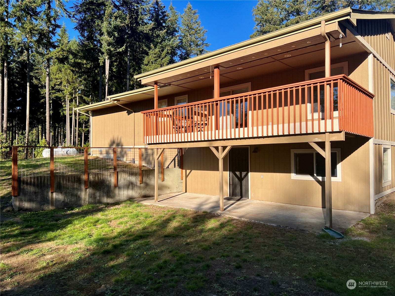 1951 Southeast Van Skiver Road Port Orchard, WA 98367 - Photo 26 of 30 a view of a house with a wooden deck