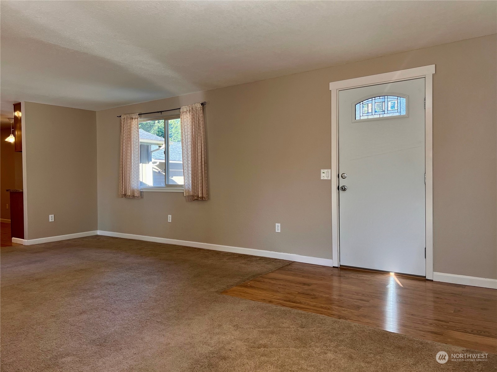 1951 Southeast Van Skiver Road Port Orchard, WA 98367 - Photo 5 of 30 an empty room with window and wooden floor