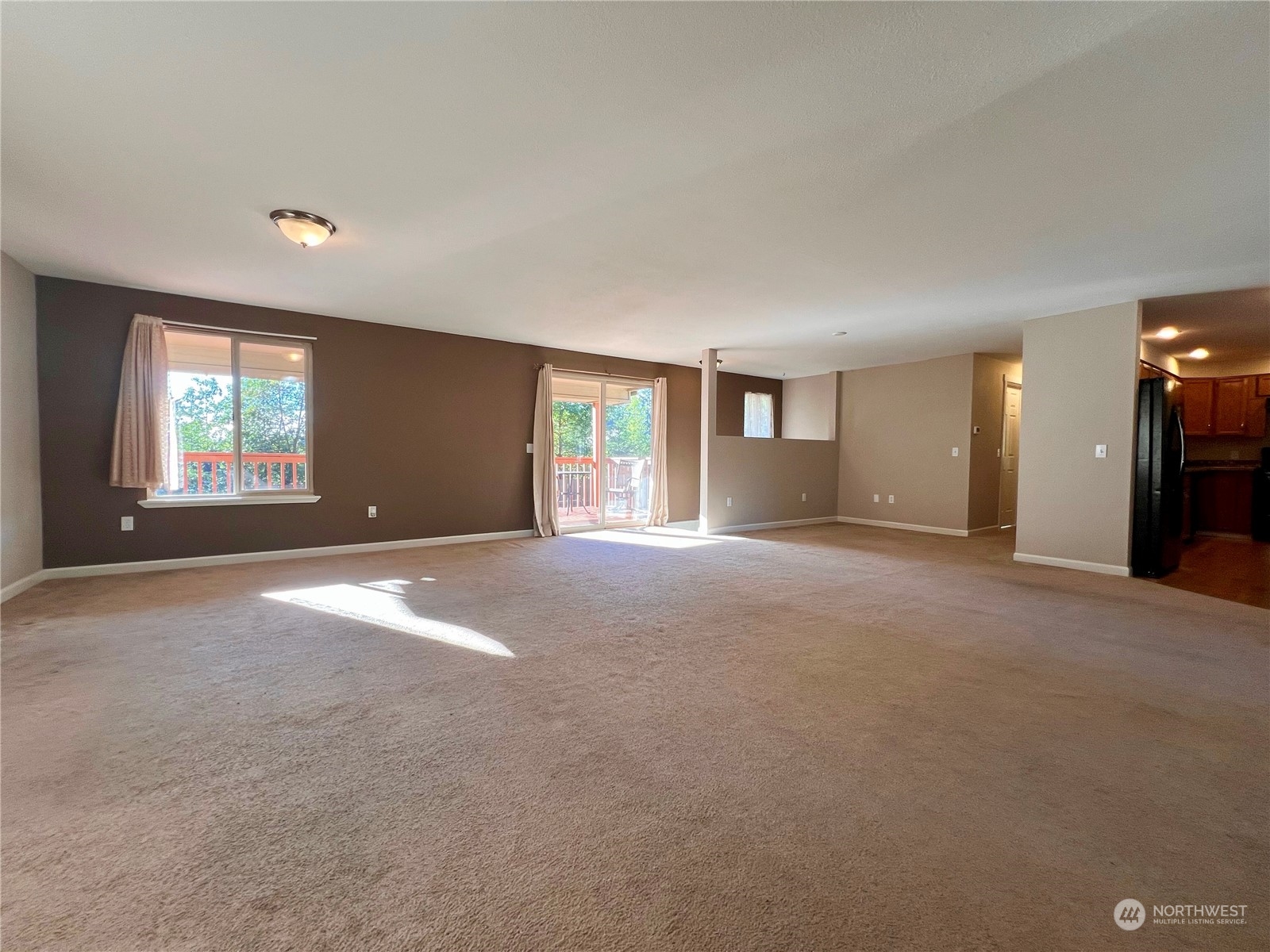 1951 Southeast Van Skiver Road Port Orchard, WA 98367 - Photo 6 of 30 a view of a big room with windows and closet area