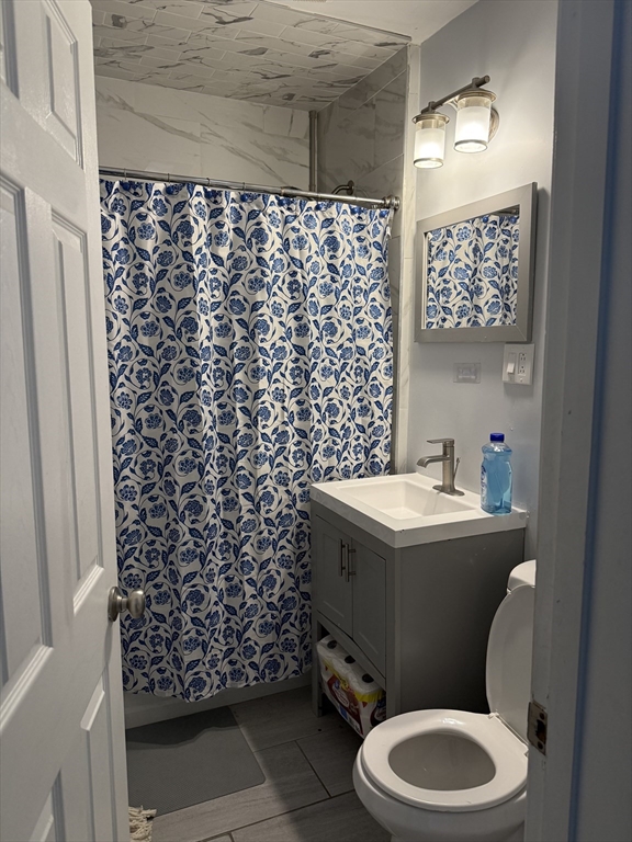 145 Eastern Avenue Worcester, MA 01605 - Photo 2 of 10 a bathroom with a sink toilet and shower