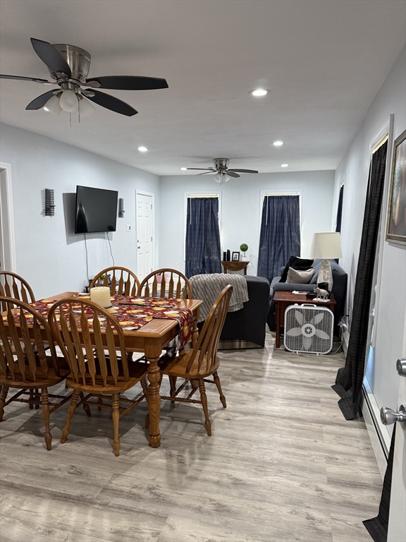 145 Eastern Avenue Worcester, MA 01605 - Photo 3 of 10 a living room with furniture a flat screen tv and a table