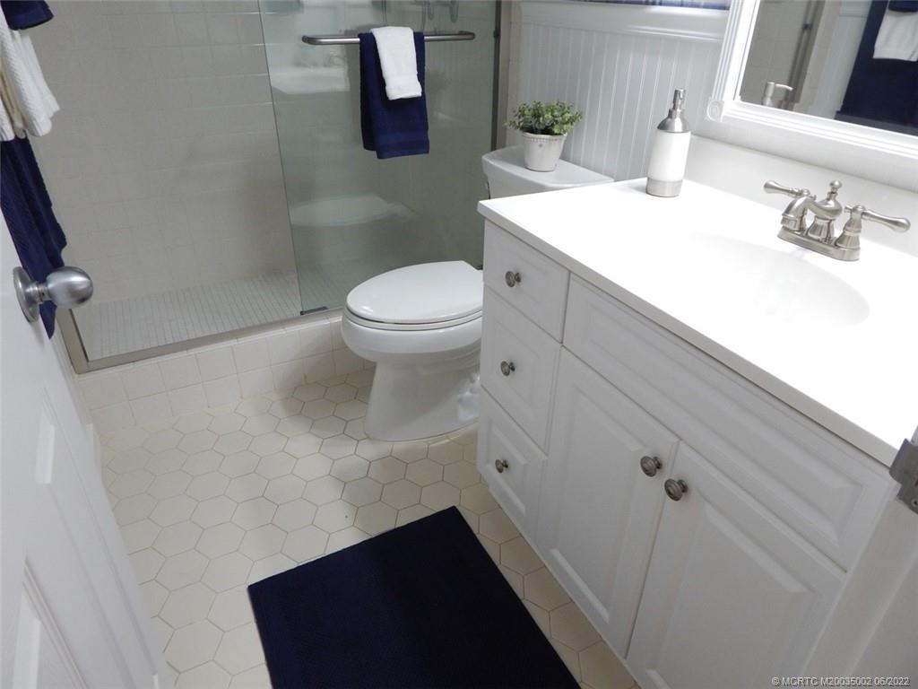2950 Southeast Ocean Boulevard, Unit 74 Stuart, FL 34996 - Photo 20 of 39 a bathroom with a sink and a toilet