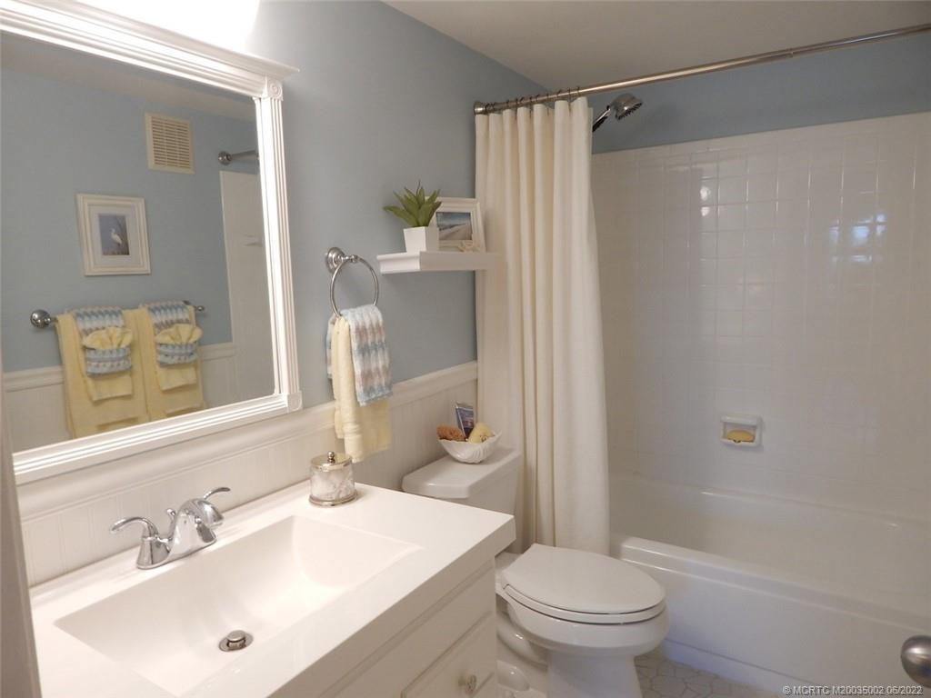 2950 Southeast Ocean Boulevard, Unit 74 Stuart, FL 34996 - Photo 27 of 39 a bathroom with a sink toilet and shower