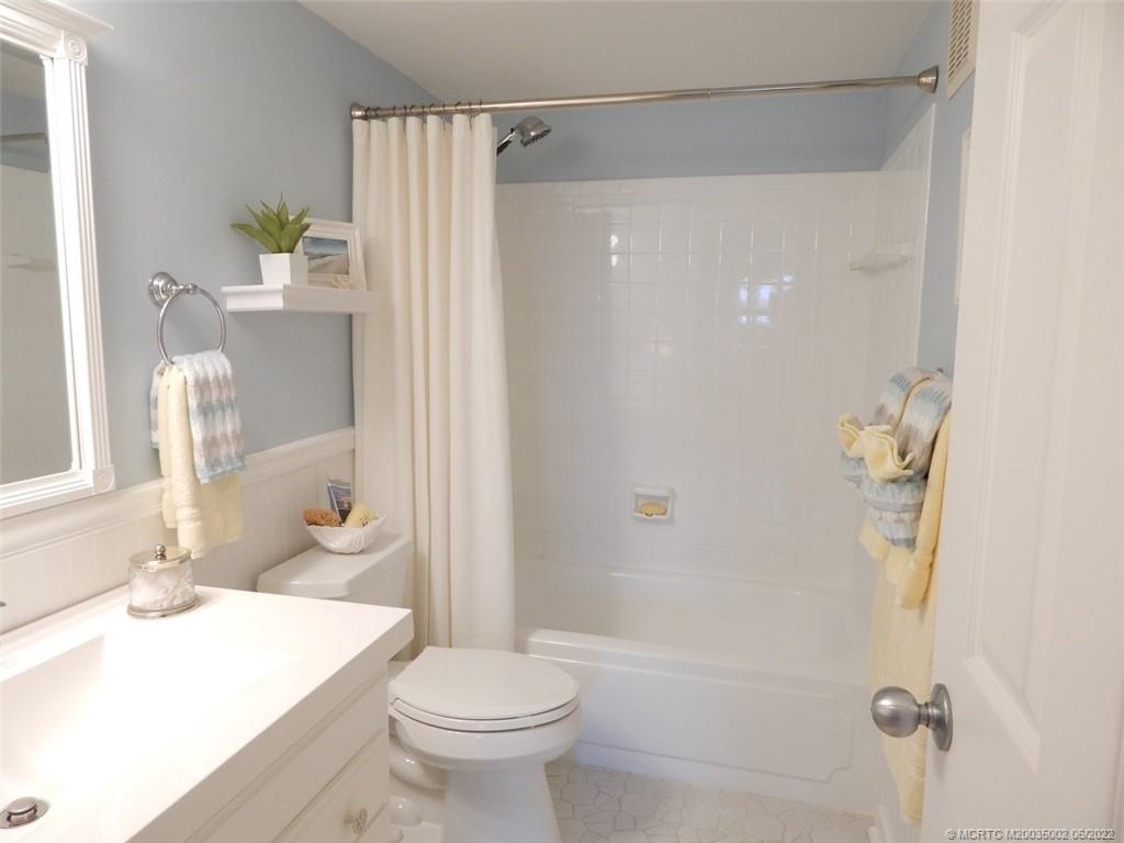2950 Southeast Ocean Boulevard, Unit 74 Stuart, FL 34996 - Photo 29 of 39 a bathroom with a sink toilet and shower