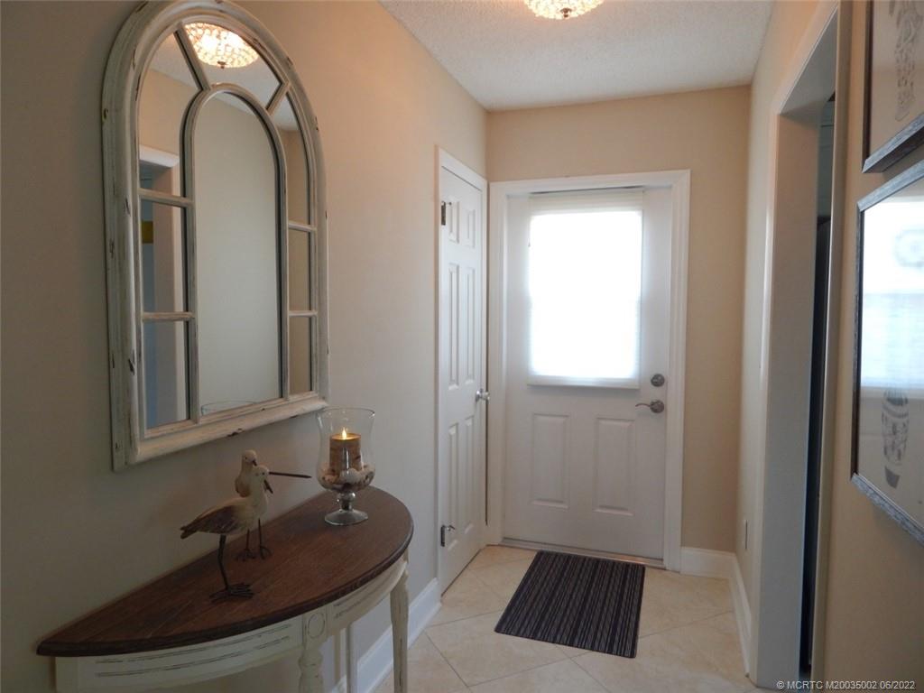 2950 Southeast Ocean Boulevard, Unit 74 Stuart, FL 34996 - Photo 30 of 39 a bathroom with a sink and a mirror