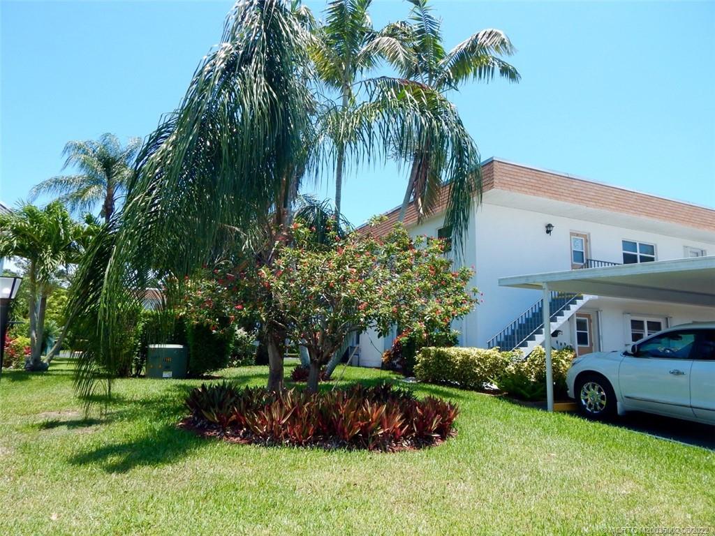 2950 Southeast Ocean Boulevard, Unit 74 Stuart, FL 34996 - Photo 33 of 39 a view of a house with a yard