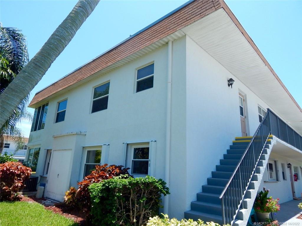 2950 Southeast Ocean Boulevard, Unit 74 Stuart, FL 34996 - Photo 34 of 39 a front view of house with yard