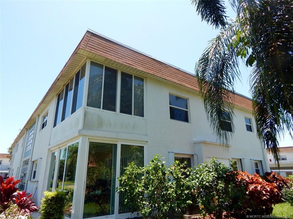 2950 Southeast Ocean Boulevard, Unit 74 Stuart, FL 34996 - Photo 35 of 39 a view of a house with a street