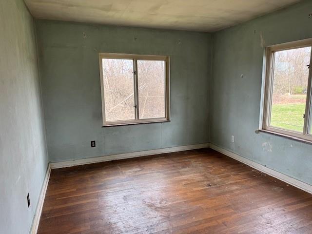 225 Old Leechburg Road Pittsburgh, PA 15239 - Photo 7 of 10 an empty room with wooden floor and windows