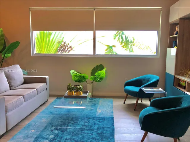 a living room with furniture and a window