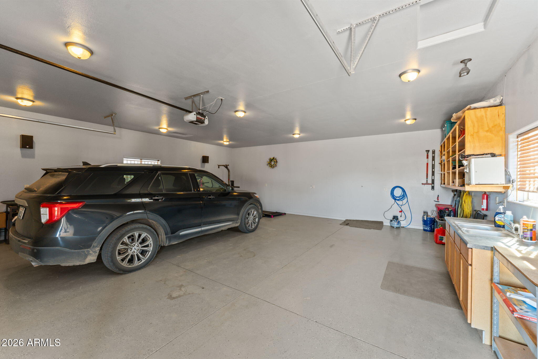 51539 West Donald Road Aguila, AZ 85320 - Photo 21 of 43 a view of parking garage with cars parked
