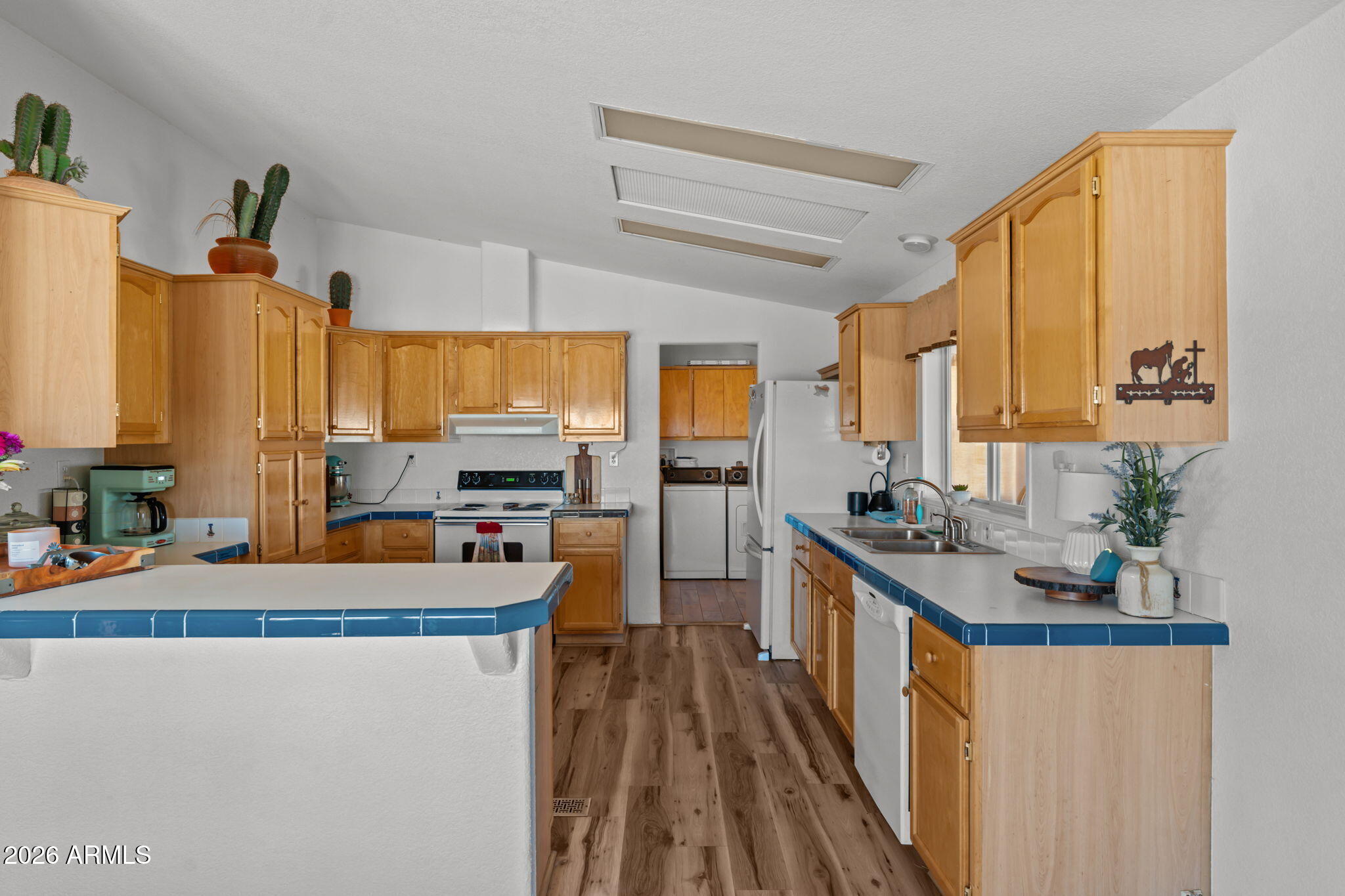 51539 West Donald Road Aguila, AZ 85320 - Photo 24 of 43 a kitchen with stainless steel appliances a sink stove and cabinets