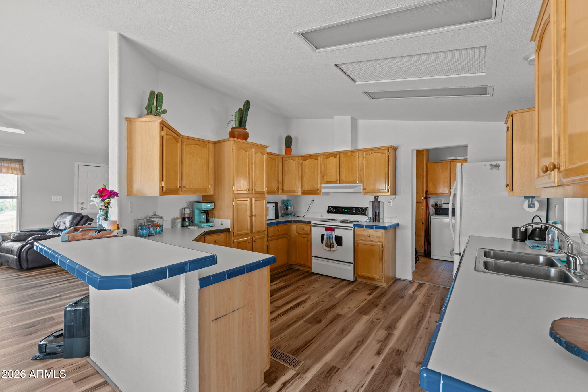 51539 West Donald Road Aguila, AZ 85320 - Photo 25 of 43 a kitchen with sink refrigerator and cabinets