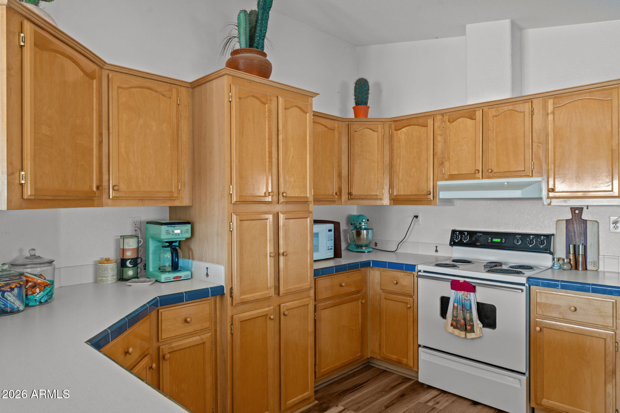 51539 West Donald Road Aguila, AZ 85320 - Photo 26 of 43 a kitchen with stainless steel appliances a stove a sink and cabinets