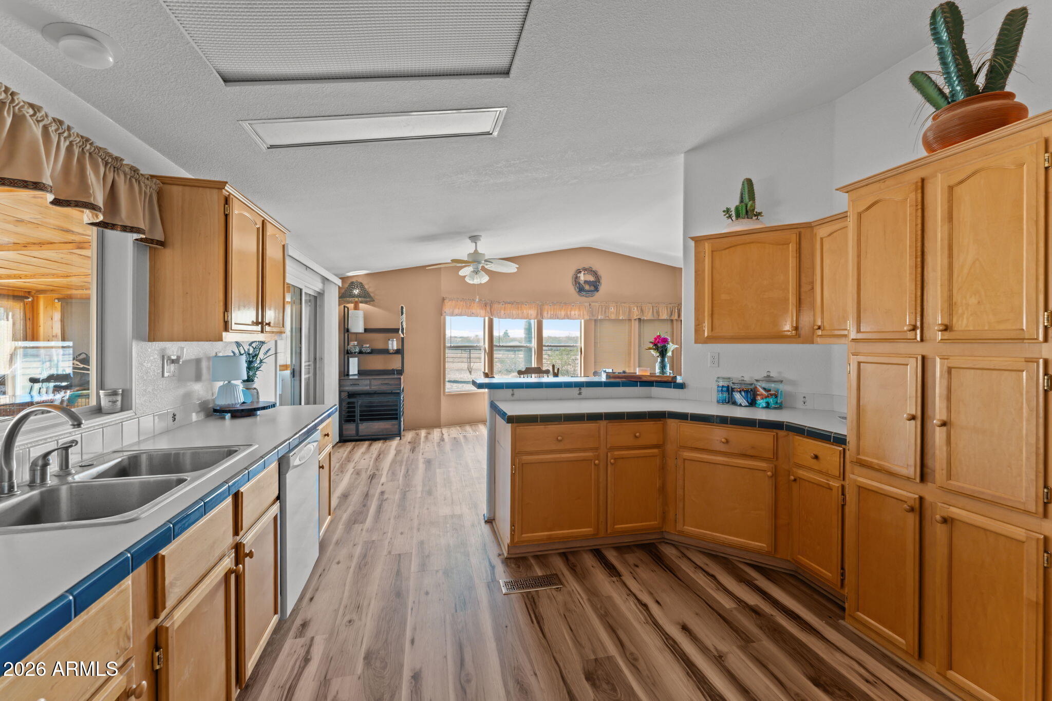 51539 West Donald Road Aguila, AZ 85320 - Photo 28 of 43 a kitchen with stainless steel appliances granite countertop a sink stove and cabinets