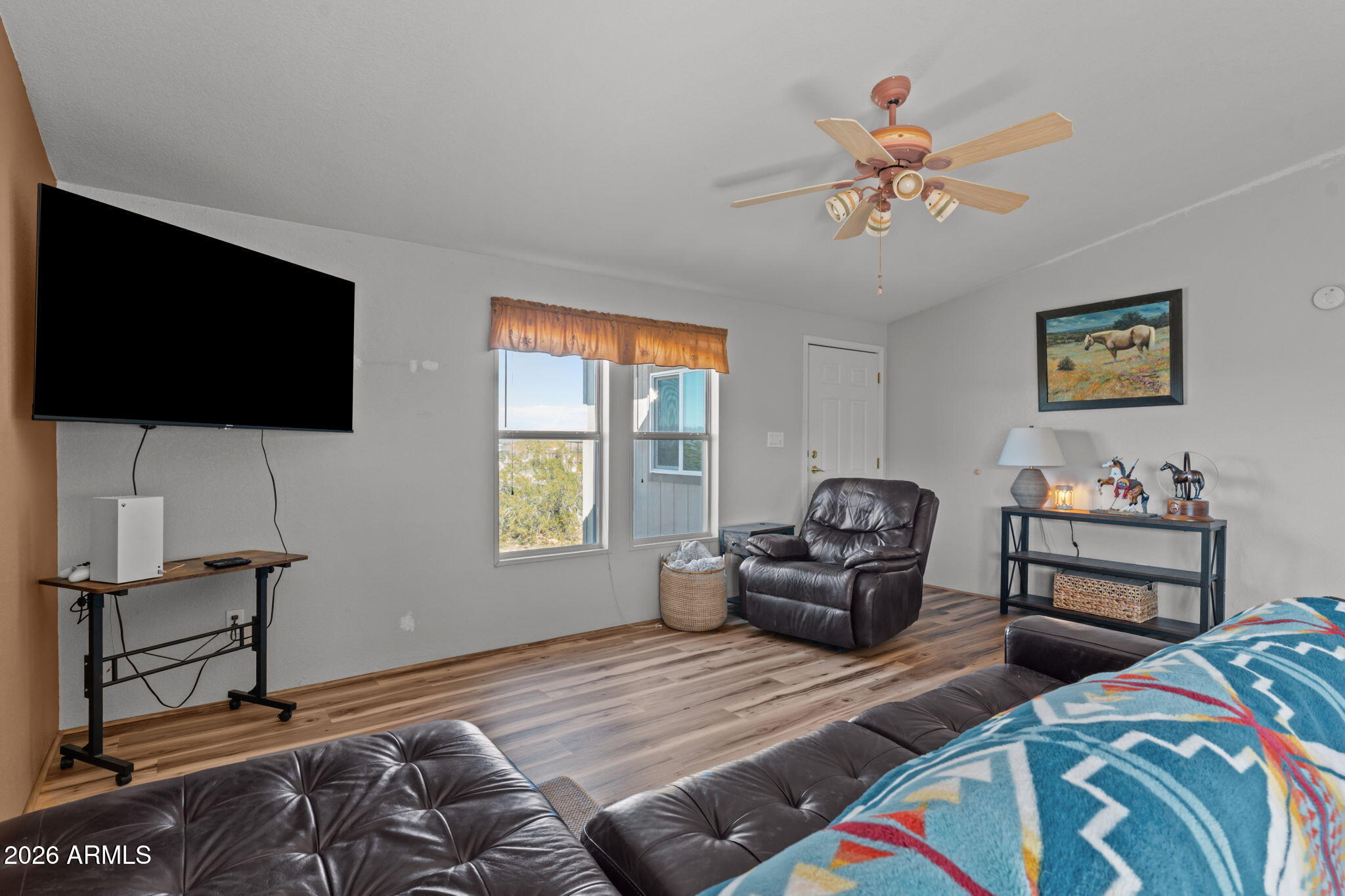 51539 West Donald Road Aguila, AZ 85320 - Photo 32 of 43 a bedroom with furniture and a flat screen tv