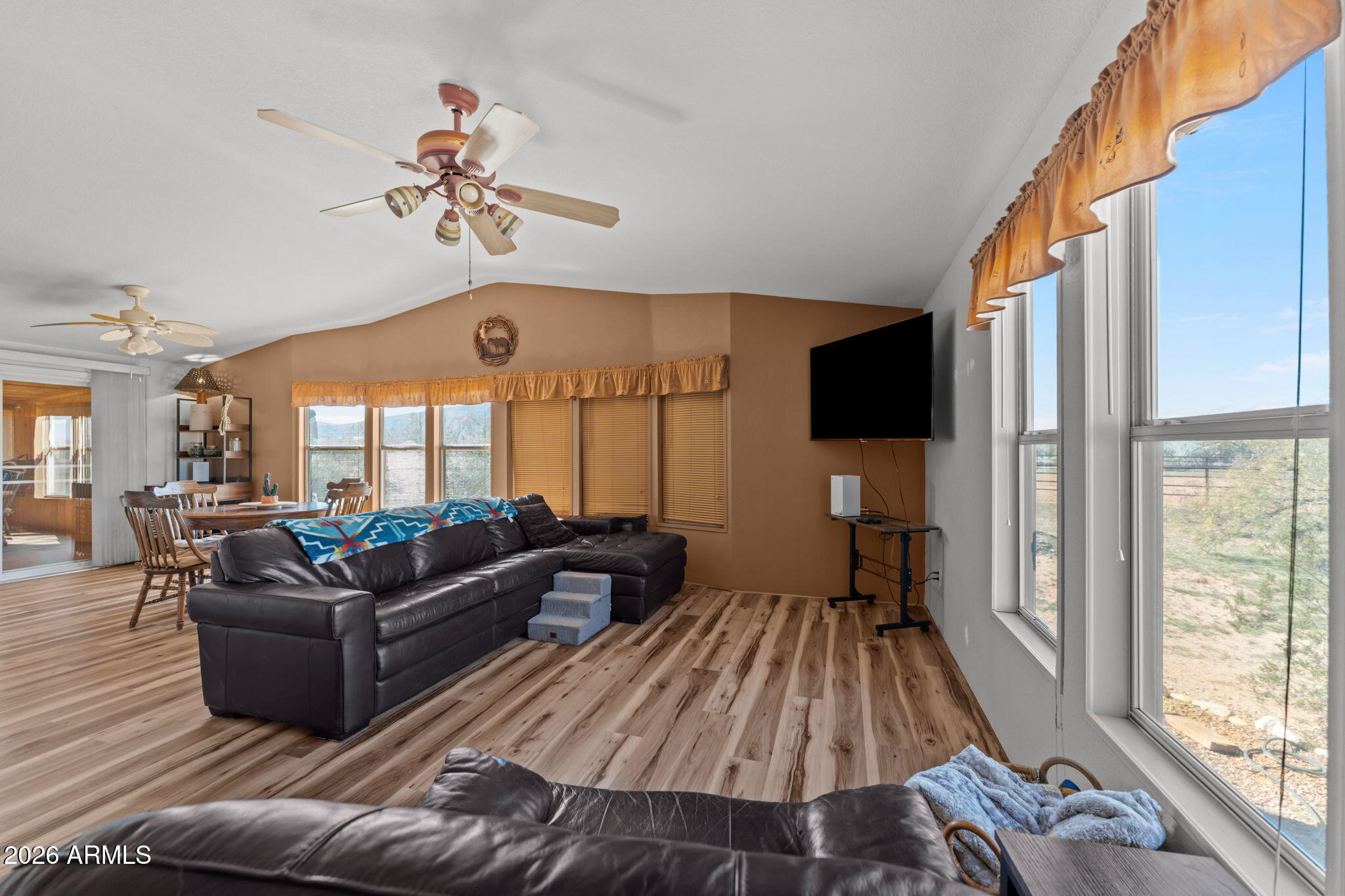 51539 West Donald Road Aguila, AZ 85320 - Photo 33 of 43 a living room with furniture fireplace and a large window