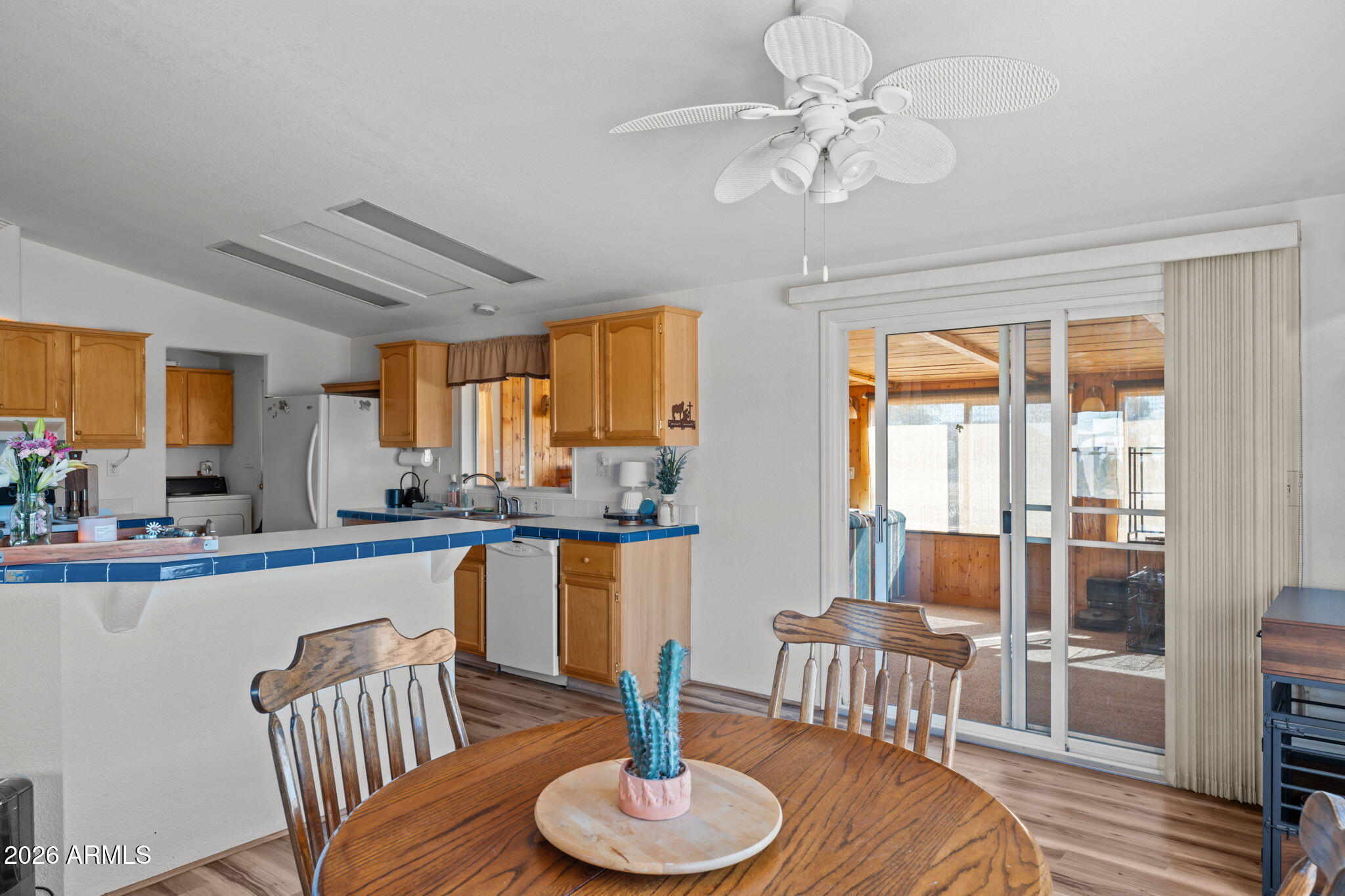 51539 West Donald Road Aguila, AZ 85320 - Photo 36 of 43 a dining room with furniture a chandelier and wooden floor