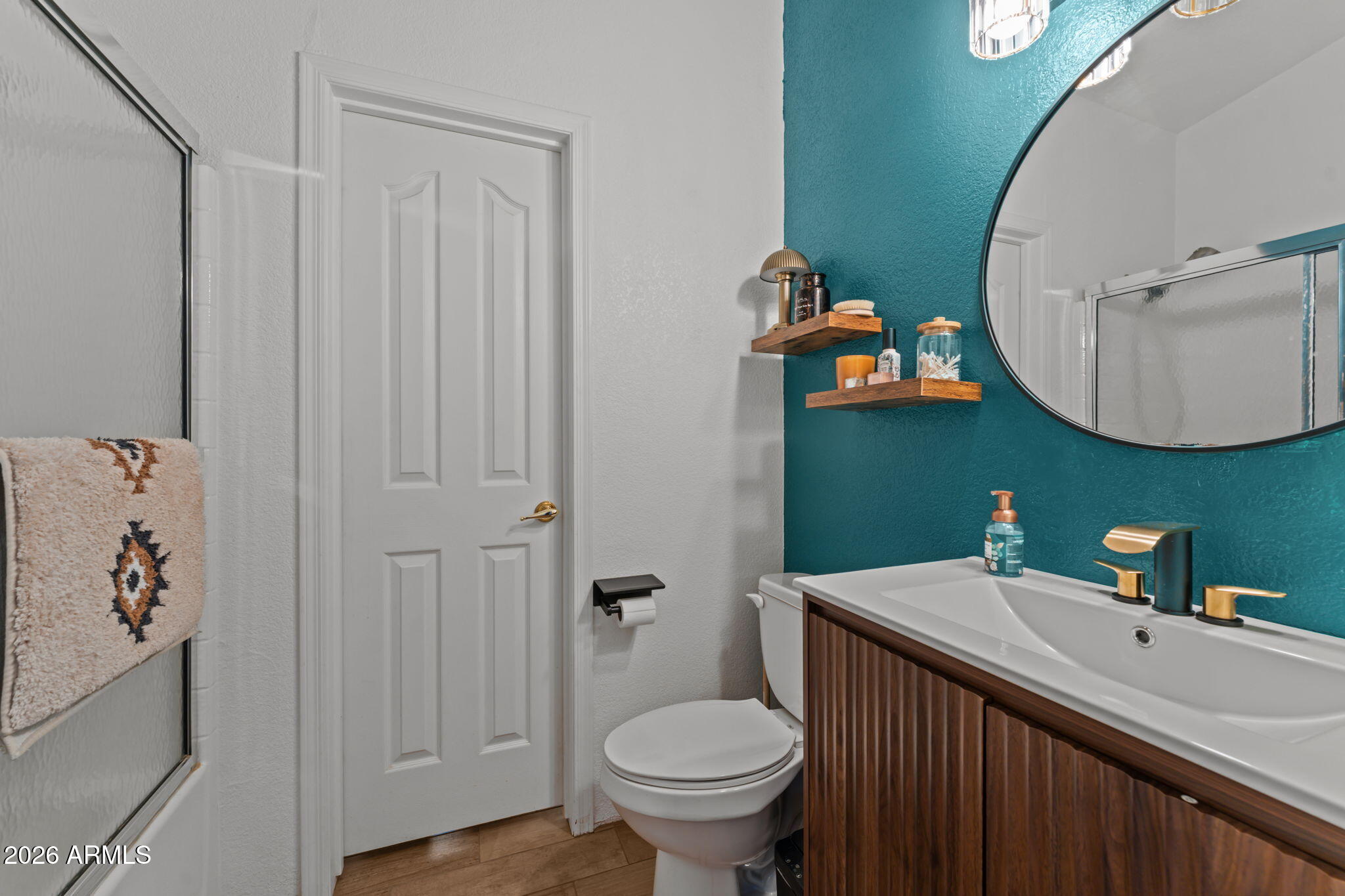 51539 West Donald Road Aguila, AZ 85320 - Photo 38 of 43 a bathroom with a toilet sink and mirror