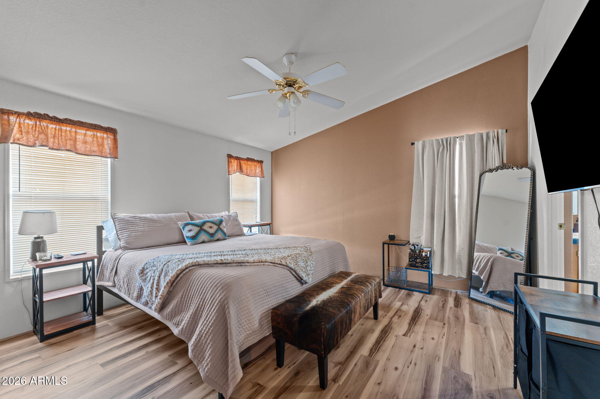 51539 West Donald Road Aguila, AZ 85320 - Photo 39 of 43 a bedroom with a bed and a flat tv screen on dresser