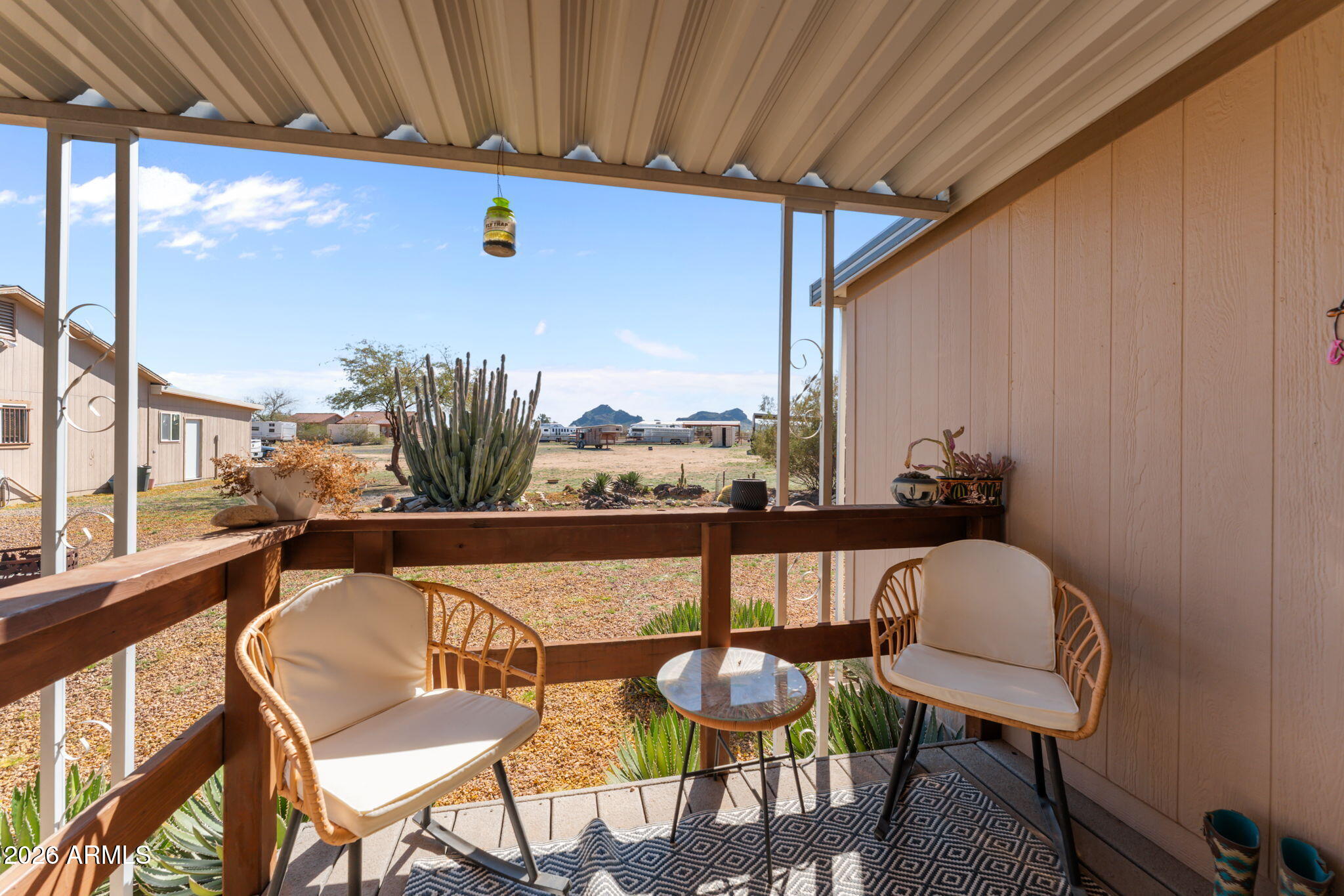 51539 West Donald Road Aguila, AZ 85320 - Photo 41 of 43 a balcony with table and chairs