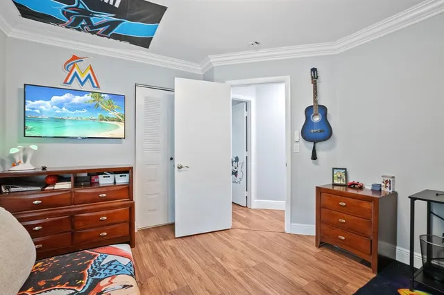 a room with furniture and flat screen tv