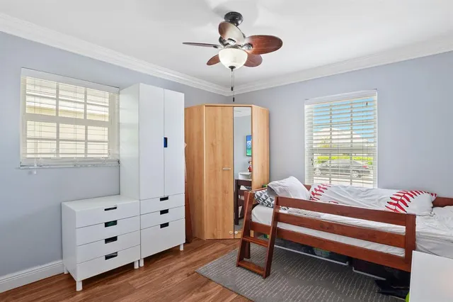 a bedroom with furniture and window