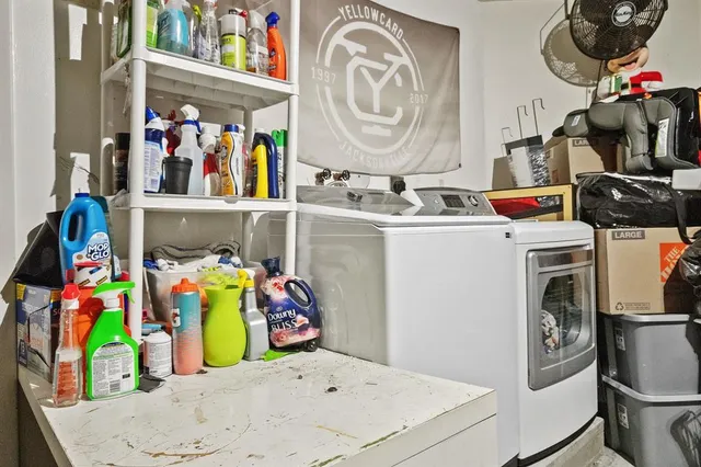 a utility room with dryer and washer
