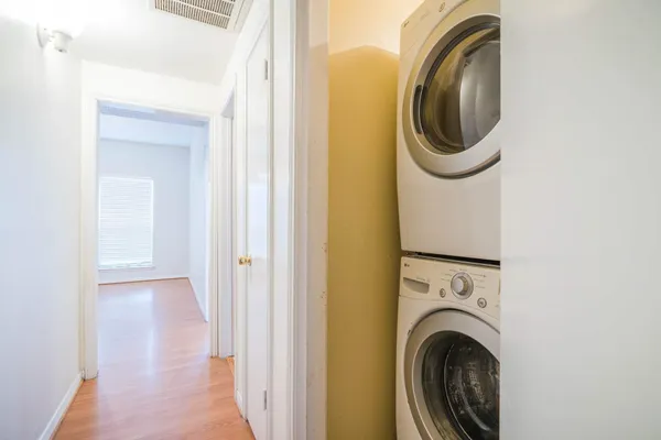 a view of a hallway with washer and dryer