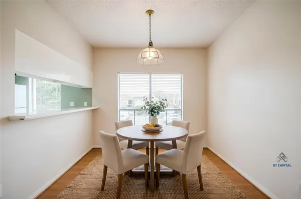 a dining room with furniture and window