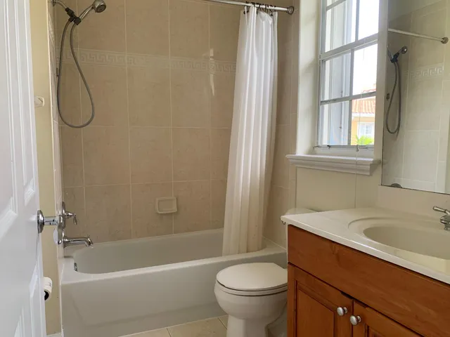 a bathroom with a sink a toilet and a bathtub